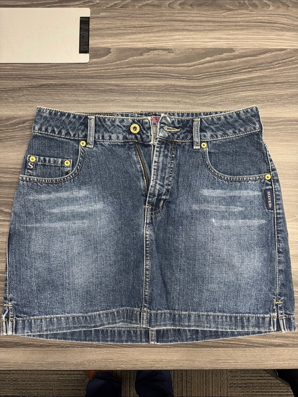 Silver Jeans Mid-Blue Denim Mini Skirt with Yellow Rivet Hardware